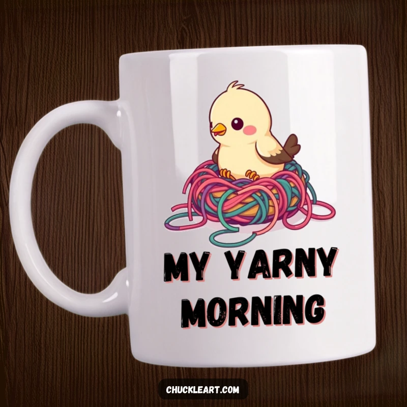 Funny bird mug showing a bird struggling to build a nest with colorful, tangled yarn, representing crafty chaos and humor.