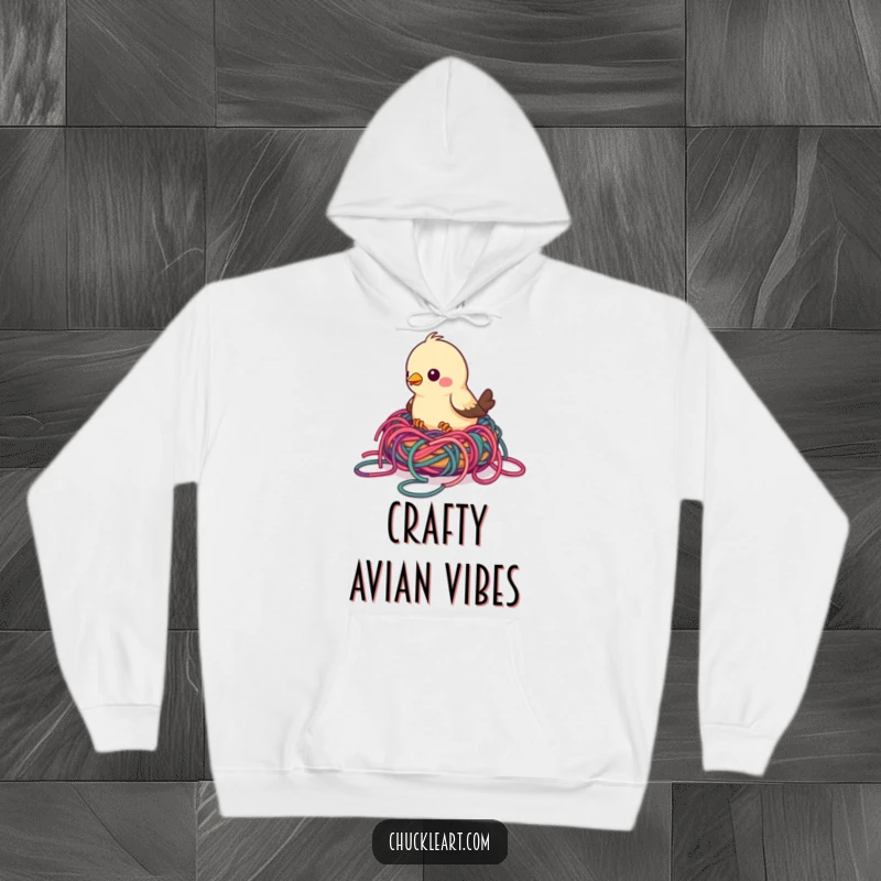 Funny bird hoodie featuring a bird building a nest with colorful, tangled yarn, offering warmth and humorous crafty charm.