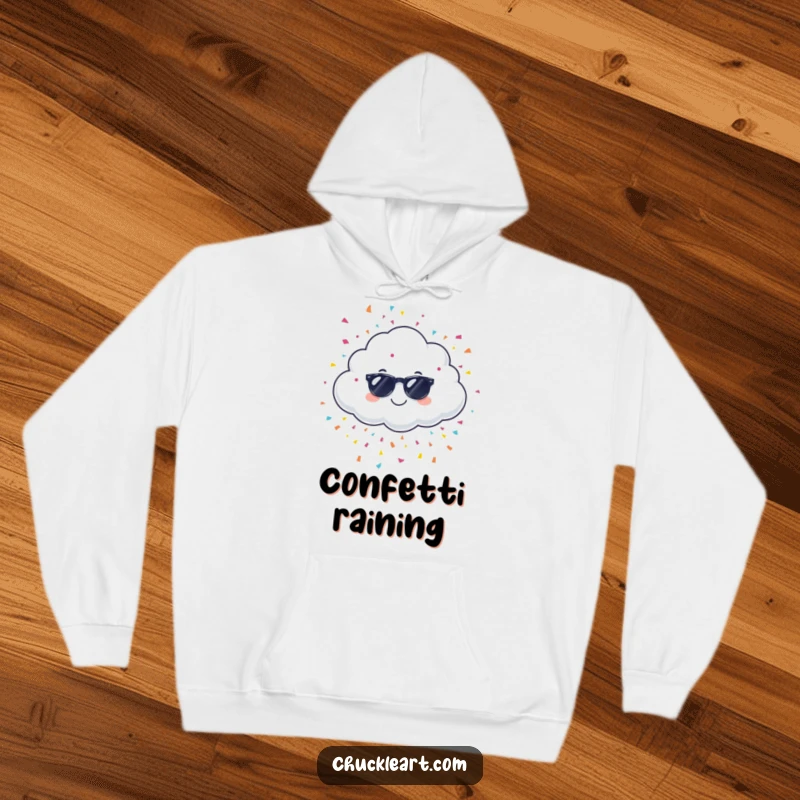 Funny giggling cloud wearing sunglasses, raining confetti, on a hoodie, a comfortable and humorous apparel item.