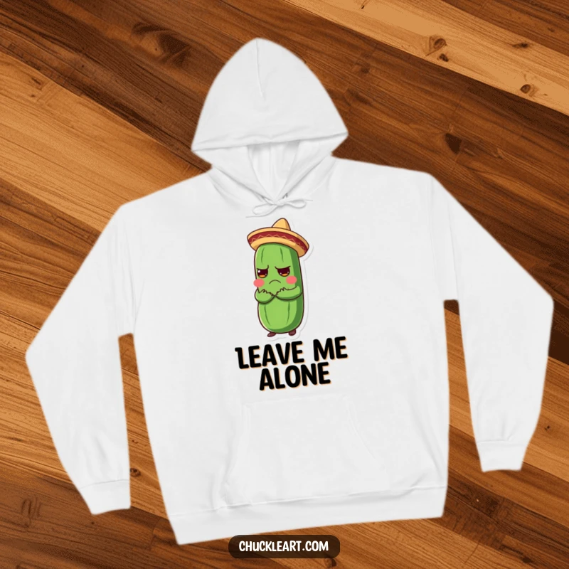 Funny hoodie featuring a grumpy pickle in a tiny sombrero receiving an enthusiastic hug, a comical embrace.