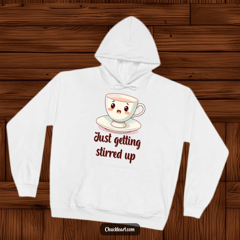 Funny spinning teacup hoodie, a surprised cup mid-spin on its saucer, offering cozy comfort and whimsical delight.