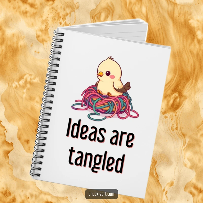 Funny bird notebook depicting a bird building a nest with colorful, tangled yarn, ideal for jotting notes and inspiring crafty ideas.