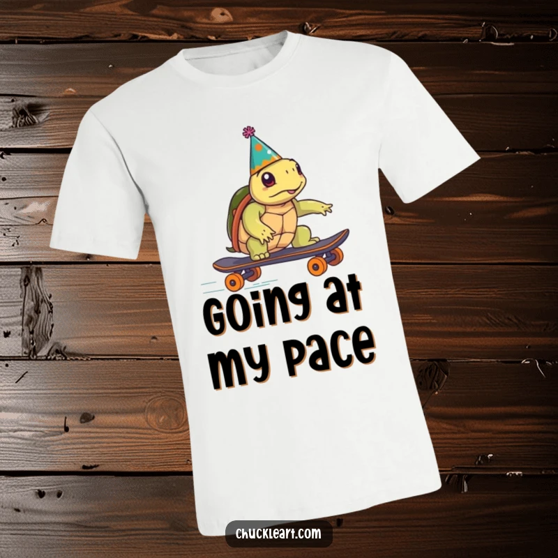 Funny turtle wearing a party hat zooms (or tries to) on a skateboard, hilariously failing, printed on a comfortable tee for a funny gift.