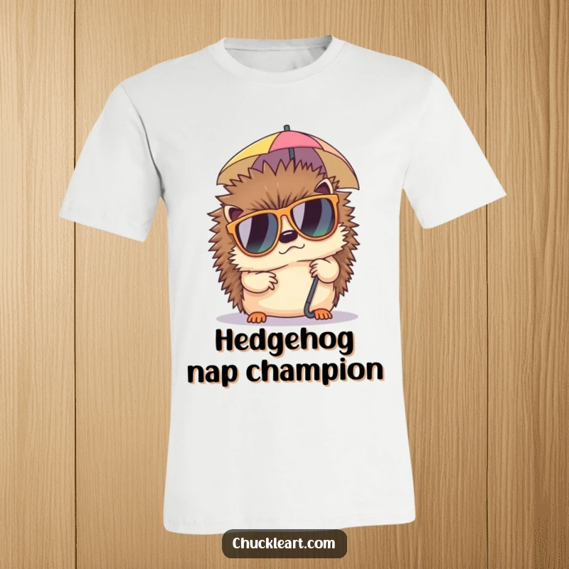 Funny t-shirt featuring a grumpy hedgehog wearing sunglasses, attempting to nap under a miniature umbrella, a symbol of pure relaxation.