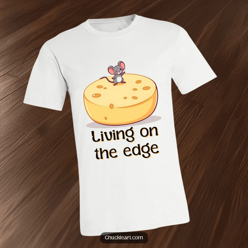 Funny t-shirt print of a small mouse attempting to balance on a large, unsteady wheel of cheese, showcasing daring feats.